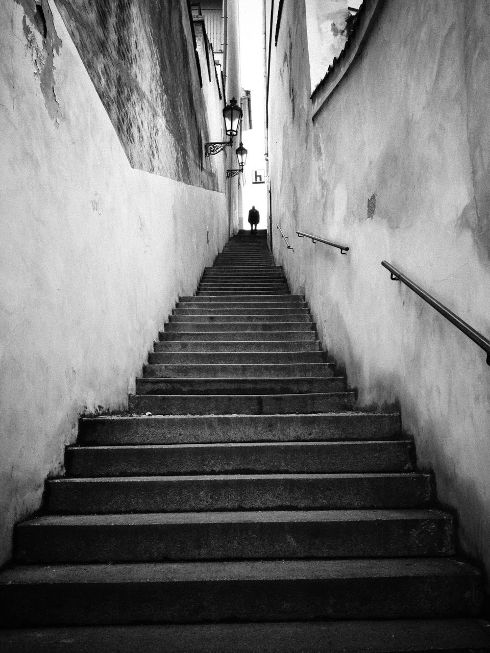 steps, steps and staircases, the way forward, staircase, architecture, built structure, building exterior, diminishing perspective, stairs, vanishing point, low angle view, narrow, railing, building, wall - building feature, men, moving up, walking, day