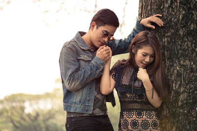 Happy friends standing outdoors