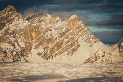 Tilt shift effect of snowy slopes of torre sabbioni peaks at sunset