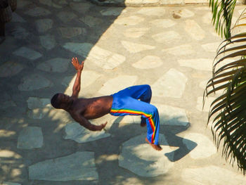 High angle view of man shadow on floor