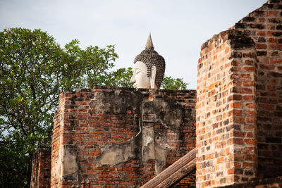 Low angle view of old building against sky