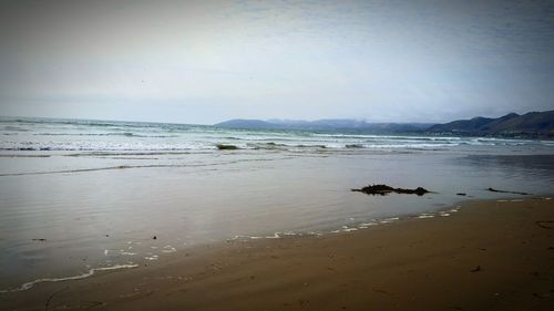 Scenic view of beach against sky