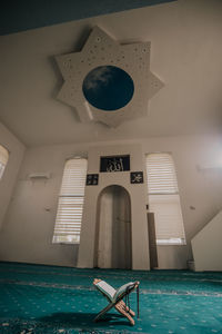 People in swimming pool against building