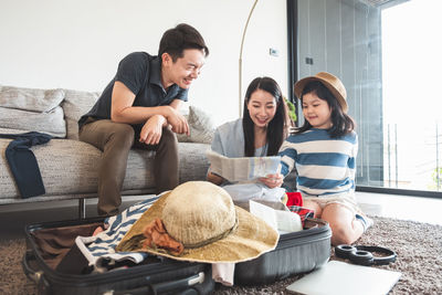 Young couple sitting on the floor