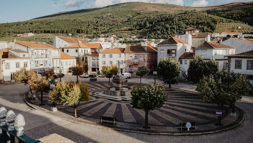 High angle view of street amidst buildings in town