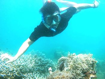 Man swimming in sea