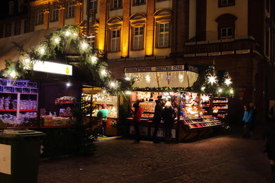 Illuminated market at night