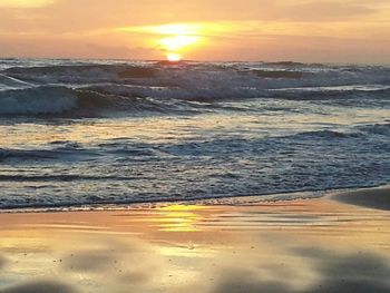 Scenic view of sea at sunset