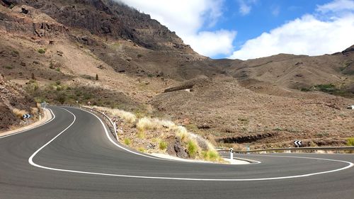 Scenic view of mountain road against sky