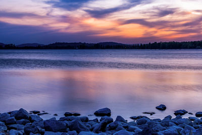 Scenic view of sea against sky at sunset