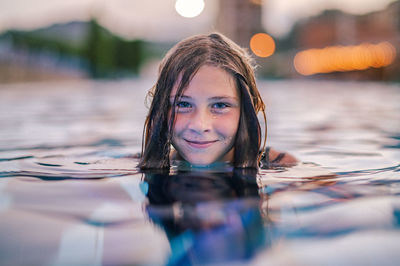 Young woman swimming in sea