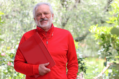 Portrait of a smiling man standing outdoors