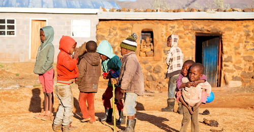 Rear view of people walking in building