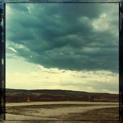 View of road against cloudy sky