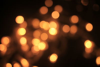 Defocused image of illuminated lights at night