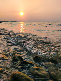 Scenic view of sea against sky during sunset