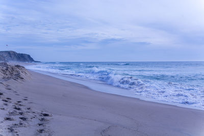 Scenic view of beach against sky