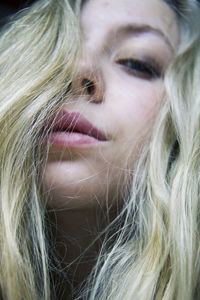 Portrait of woman with long hair at home