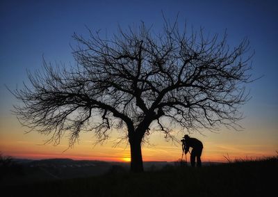 Silhouette of professional photographer outdoors