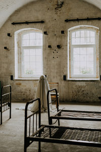 Little ghost standing in the abandoned house. autumn halloween