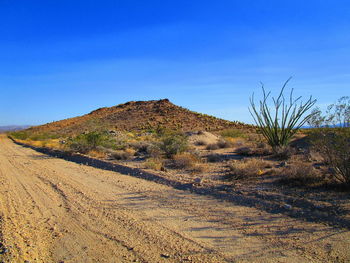 Scenic view of arid landscape against sky