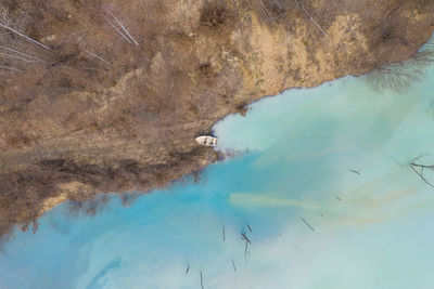 Aerial view of boat at lakeshore