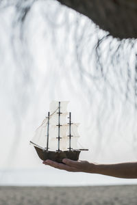 Sailboat in sea against sky