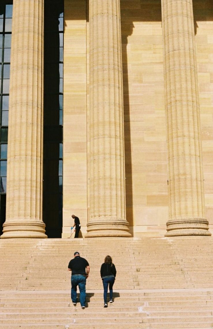 architecture, built structure, building exterior, the past, history, women, men, two people, day, architectural column, travel destinations, travel, tourism, staircase, rear view, people, real people, togetherness, adult, building, outdoors