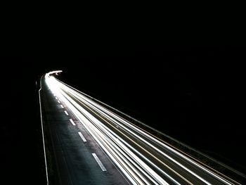 High angle view of light trails on road at night