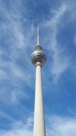 Low angle view of fernsehturm tower against sky