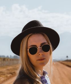 Close-up portrait of beautiful woman wearing sunglasses