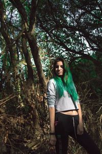 Portrait of young woman in forest