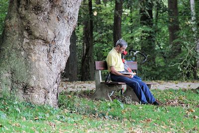 Man sitting on bench at park