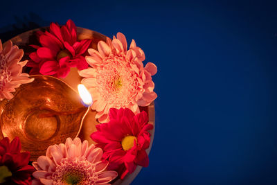 Close-up of christmas decorations against blue background