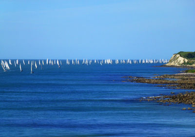 Scenic view of sea against blue sky