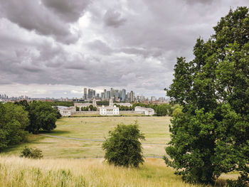 View over greenwich park to the city of london with grey clouds