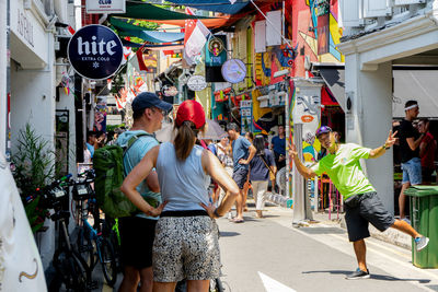 People walking on street in city