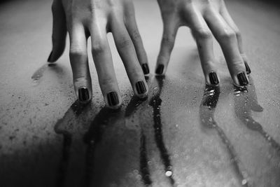 Close-up of hands on table