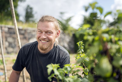 Smiling man working in garden