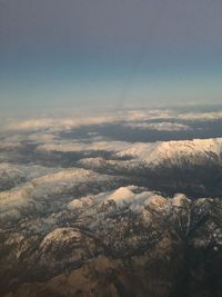 Aerial view of landscape against sky during winter