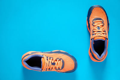 High angle view of shoes against blue background