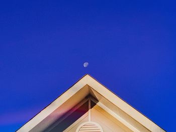 Low angle view of building against blue sky