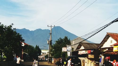 Road in city against sky