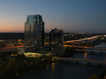 Aerial view of city lit up at night
