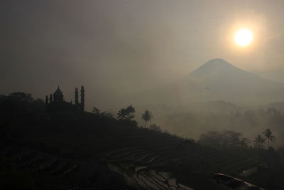 Scenic view of mountains against sky during sunset