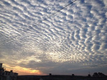 Scenic view of cloudy sky at sunset