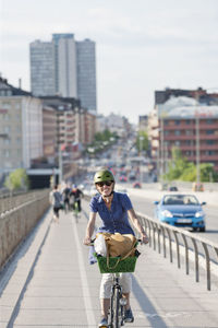 Smiling woman cycling