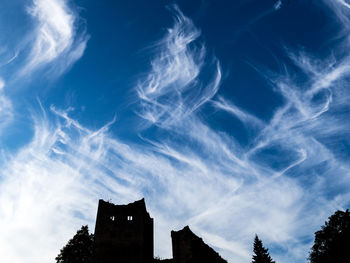 Low angle view of building against cloudy sky old castle