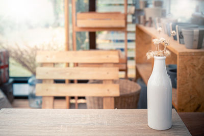 Close-up of wine bottles on table in cafe