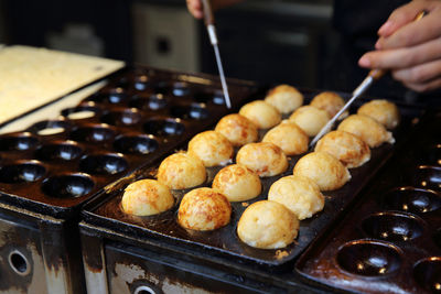 Close-up of person preparing food